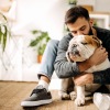 man holding a dog