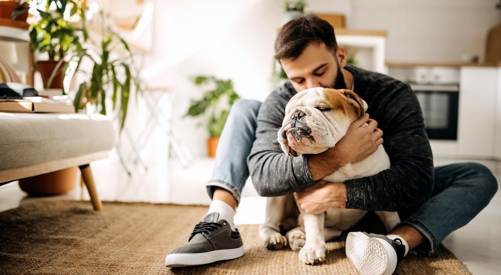Yorktown Crossing is a pet-friendly community! man holding a dog