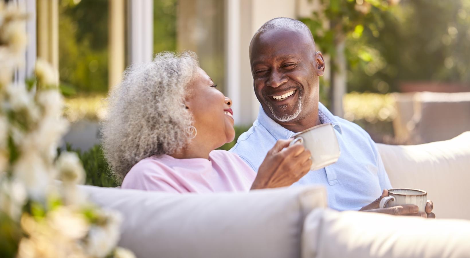 Find your perfect fit at Yorktown Crossing a man and woman sitting on a couch and smiling