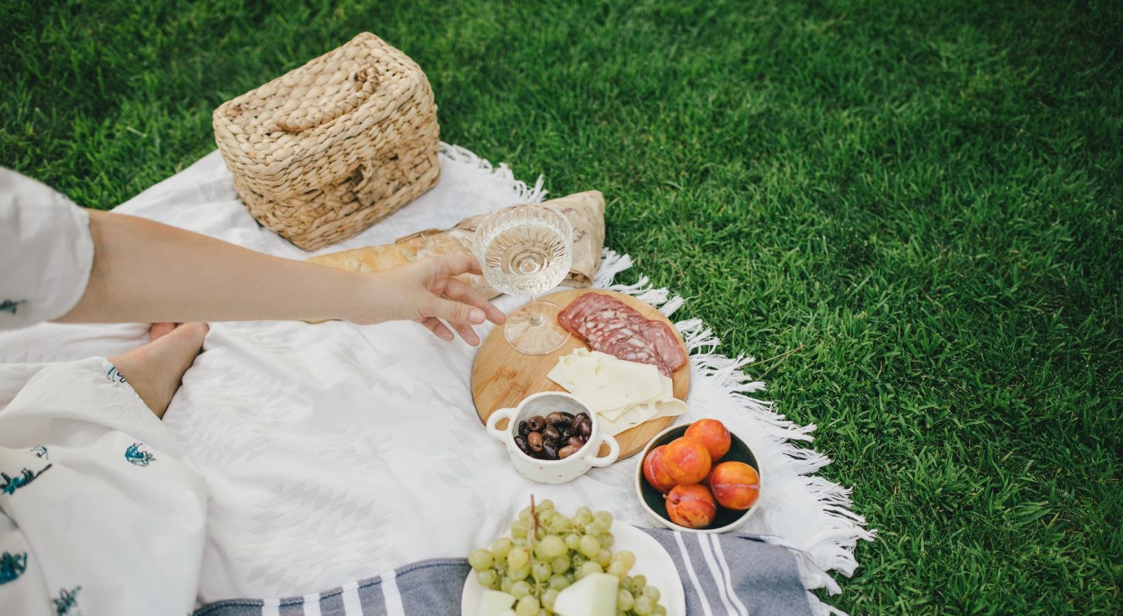 A beautiful community at the heart of all your passions woman picnic on grass lawn