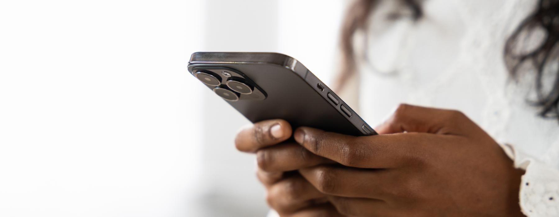 a woman holding a phone