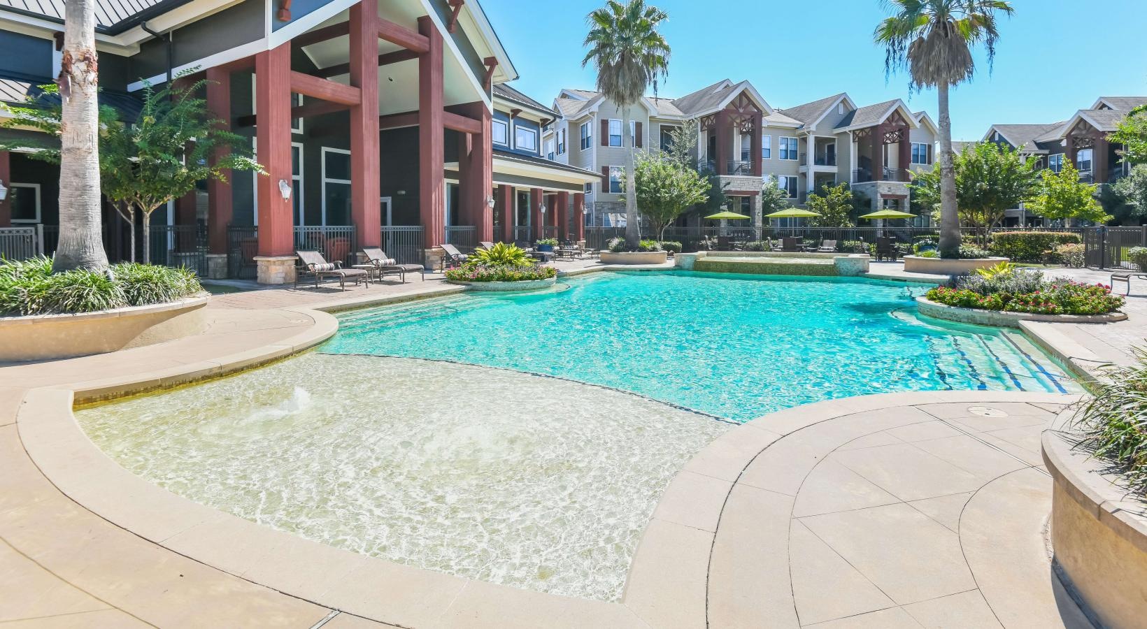 Shimmering resort-style pool outdoor swimming pool