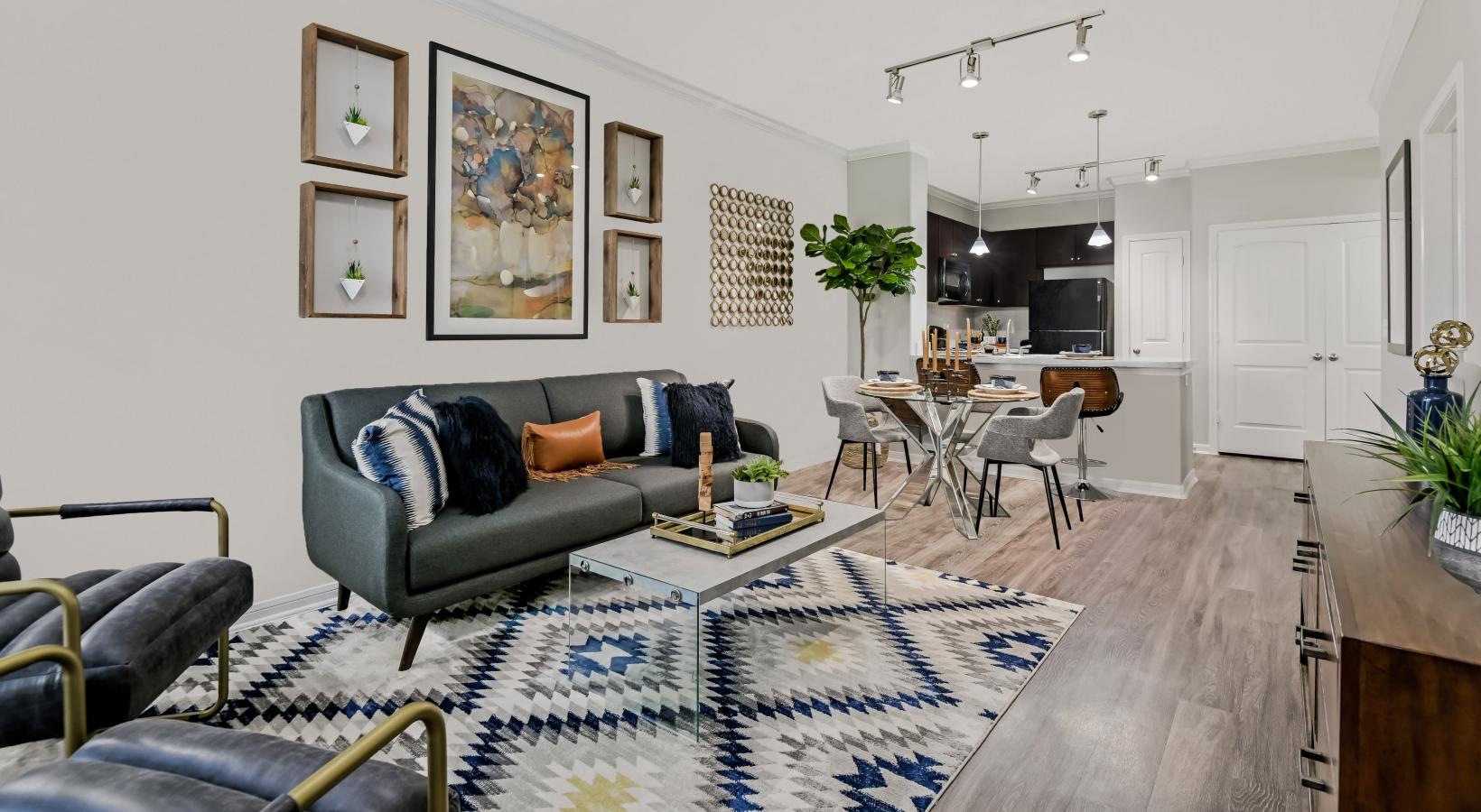 Wide open living areas perfect for entertaining a living room with a rug and a table