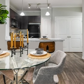a dining room with a table and chairs